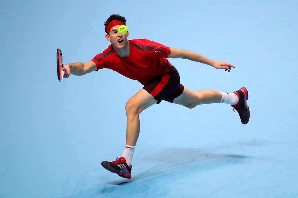 Dominic Thiem reaches for the ball.