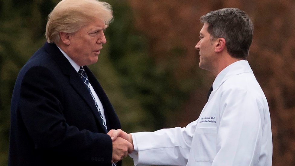 Donald Trump shakes hands with Dr Ronny Jackson after his annual physical exam at Walter Reed National Military Medical Center in Bethesda, Maryland, 12 January 2018