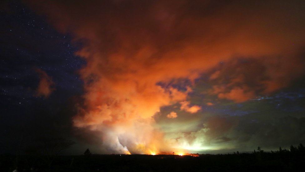 MAY 15: Lava from active fissures illuminates volcanic gases from the Kilauea volcano amidst stars on Hawaii's Big Island on 15 May 2018 in Hawaii Volcanoes National Park, Hawaii.