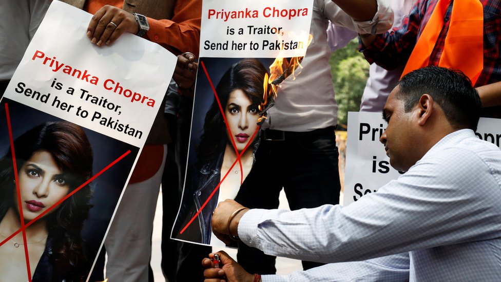 Supporters of Hindu Sena, a right wing Hindu group, shout slogans and burn posters of Bollywood actress Priyanka Chopra during a protest in June 9 2018