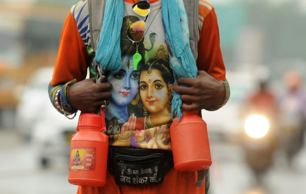 A Kanwariya seen wearing a t-shirt with the Hindu god Shiva printed on it.