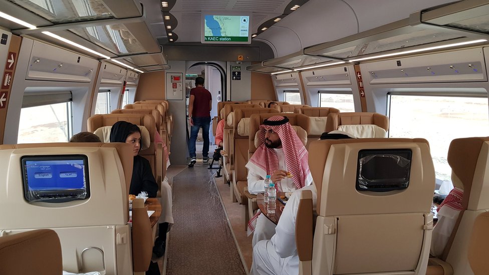 Saudis sit inside a new high-speed Haramain Express train in Jeddah, Saudi Arabia (18 September 2018)