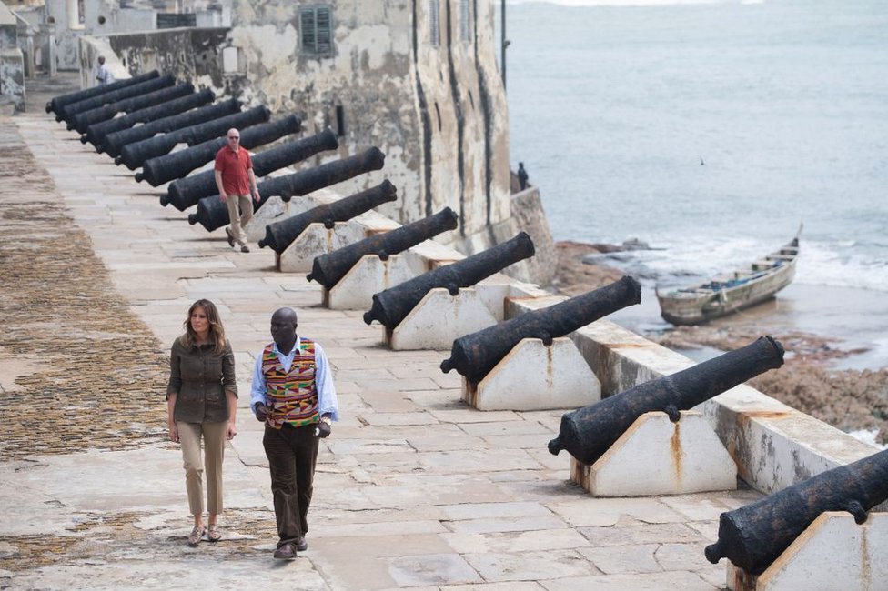 US First Lady Melania Trump with Kwesi Essel-Blankson, Museum Educator, at the Cape Coast Castle, a former slave trading fort, in Cape Coast, on October 3, 2018, during the second day of her week-long trip to Africa to promote her 'Be Best' campaign.