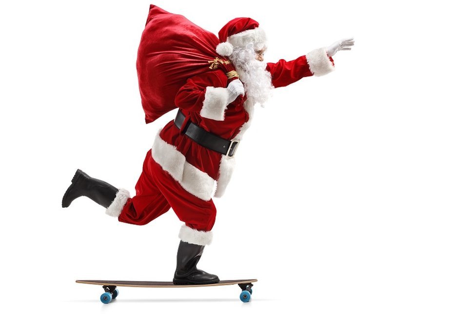 Santa Claus riding a longboard