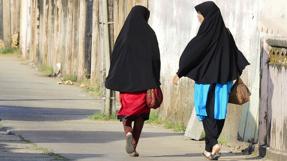 In this picture taken on April 25, 2019, Sri Lankan Muslim girls walk along a road in Kattankudy