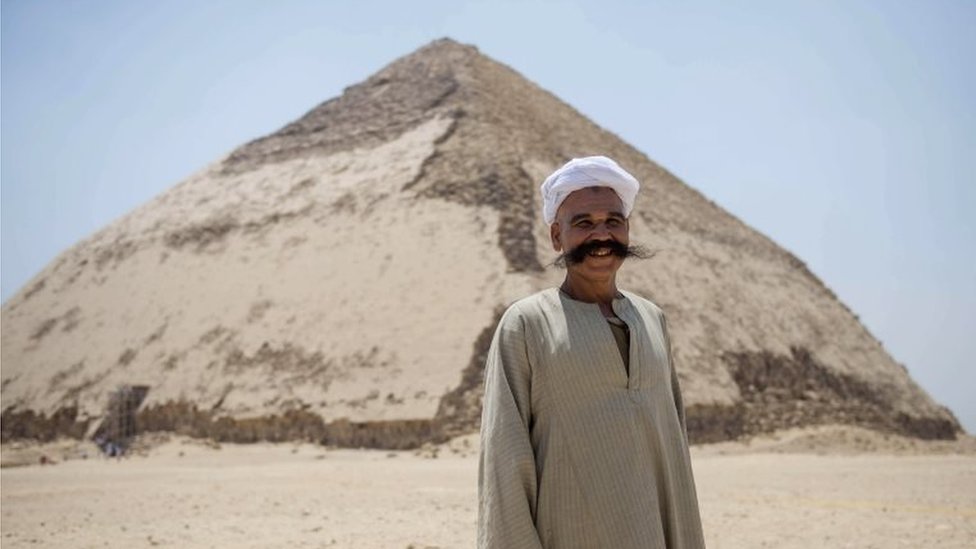 A man stands in front of the Bent Pyramid, Egypt. Photo: 13 July 2019