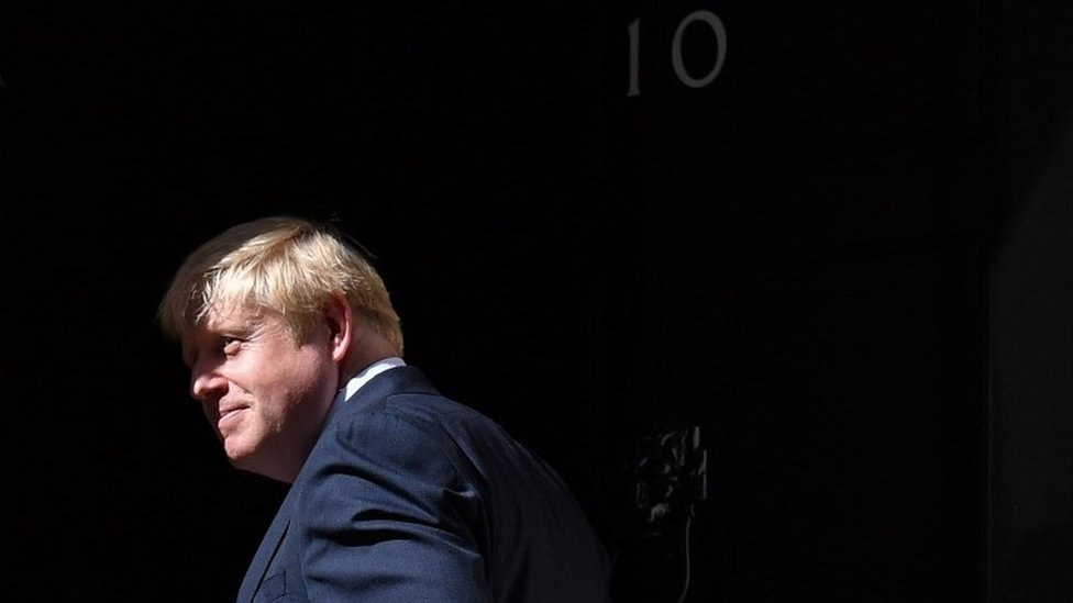 Boris Johnson walking through the door of No 10 Downing Street