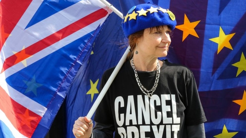 Woman with EU and UK flags