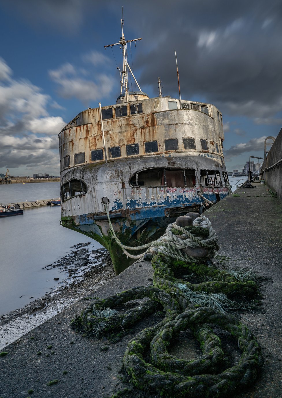 Derelict ship at a harbour