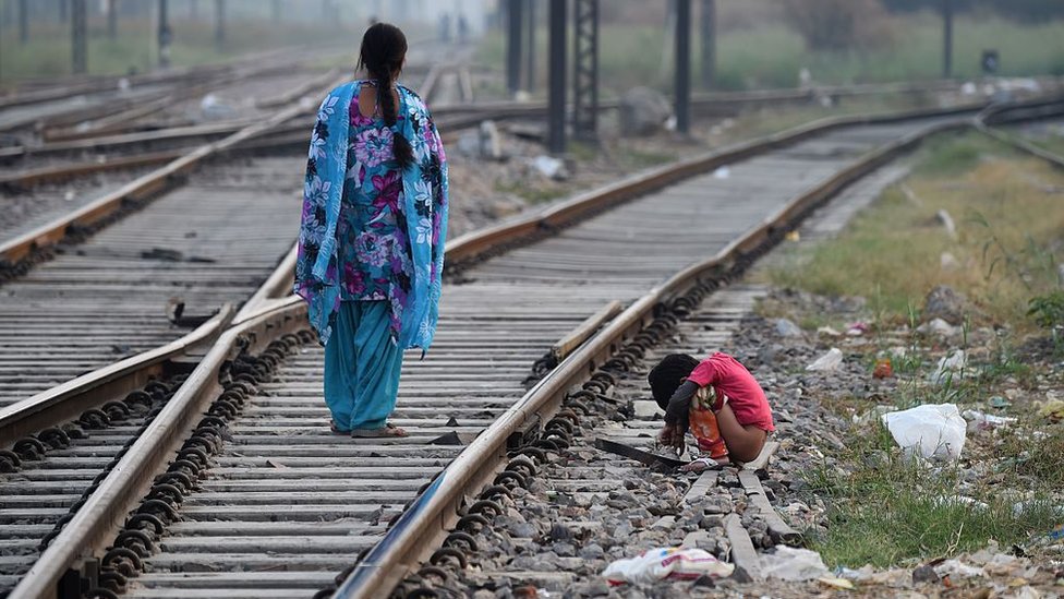 Representational image an Indian child defecating in the open