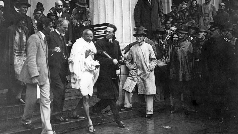 Mahatma Gandhi leaves the Friends' Meeting House, Euston Road, after attending the Round Table Conference on Indian constitutional reform.