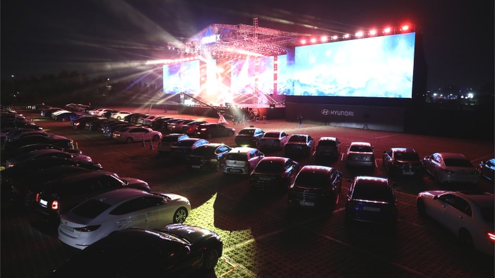 Cars are parked at a drive-in musical operation by Hyundai Motor at Stage X Drive-in Concert as South Koreans take measures to protect themselves against the spread of coronavirus
