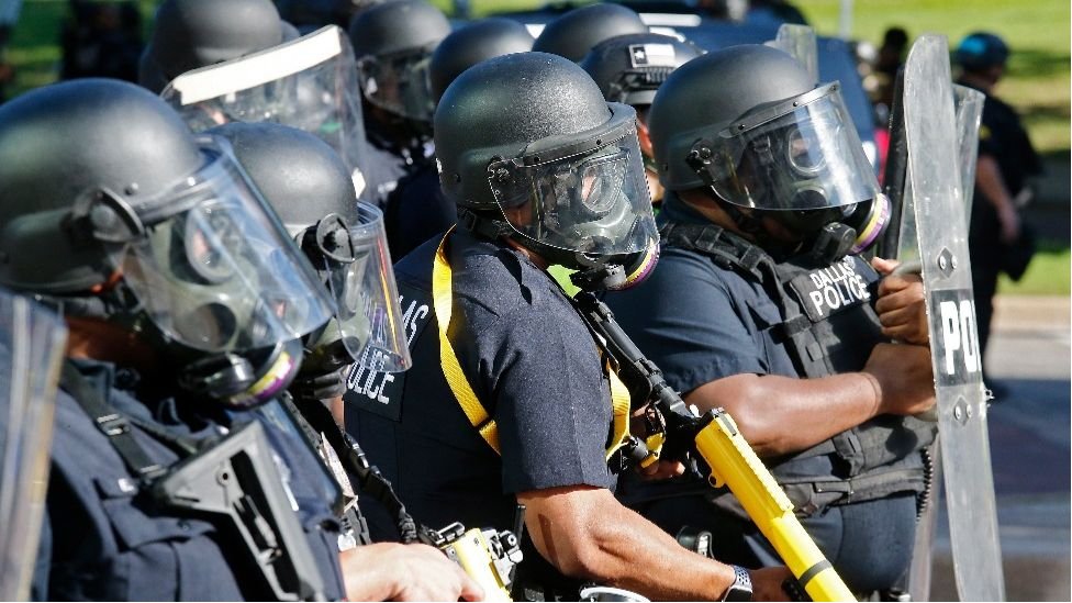 Police officers face off with demonstrators during protests over the Minneapolis arrest of George Floyd, who later died in police custody, in Dallas, Texas, USA, 30 May 2020. (EPA)