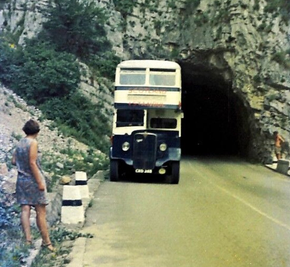 Wendy Scott standing by the side of the E27 north of Pec (Peja), now in Kosovo.