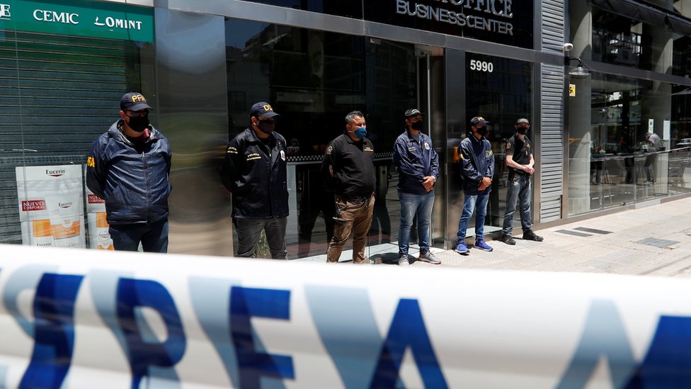 Police officers stand guard outside the building where Leopoldo Luque, the personal doctor of late Argentine soccer legend Diego Armando Maradona, has his office in Buenos Aires, Argentina November 29, 2020.