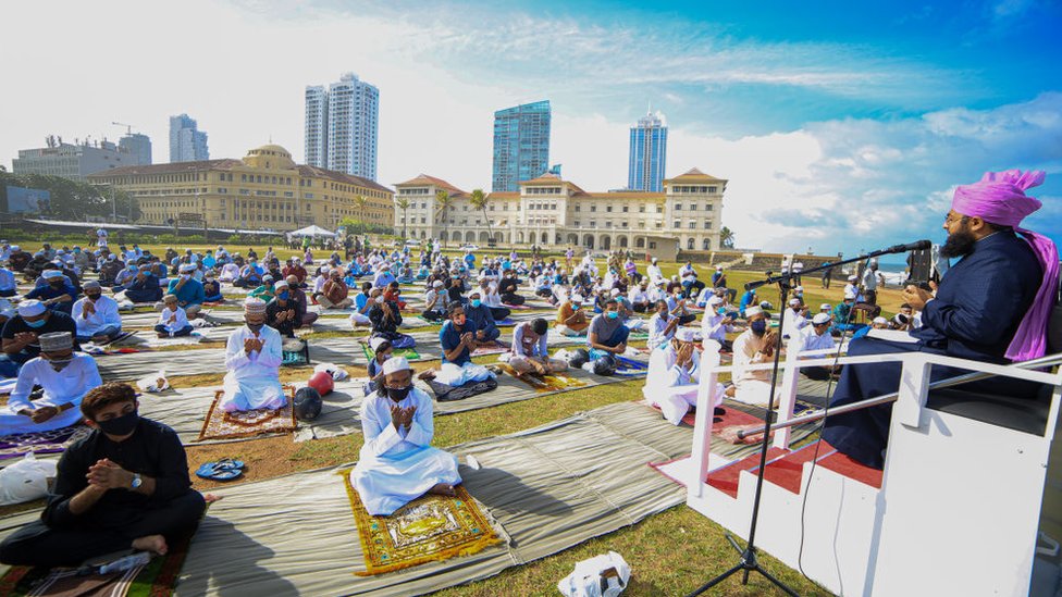 Muslims wearing face masks pray to mark Eid while social distancing in Colombo on 1 August, 2020.