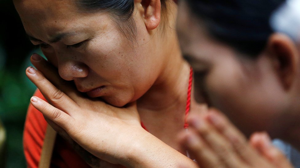 A relative is pictured looking down in a sad manner, in a close-up image