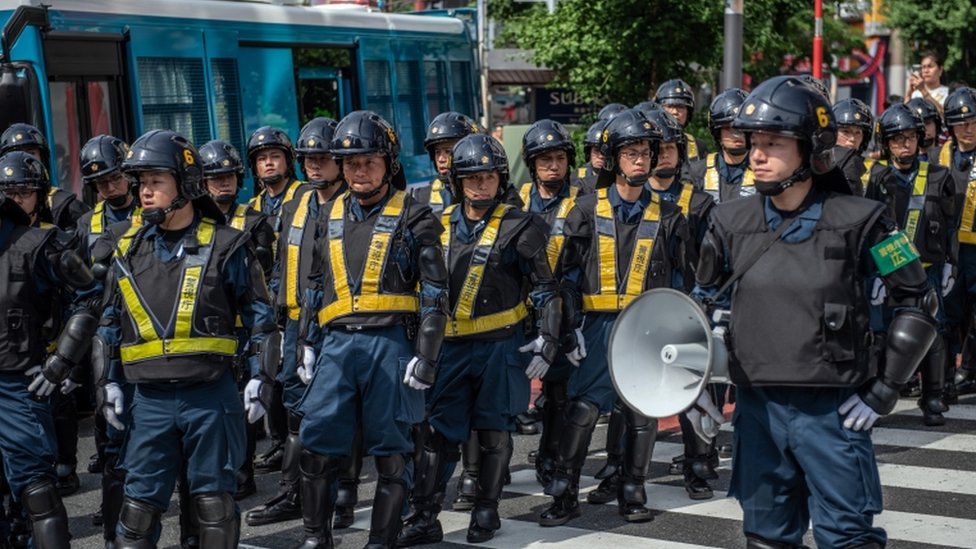Police officers look on during a protest against President Donald Trump's forthcoming meeting with Emperor Naruhito, on May 26, 2019 in Tokyo, Japan