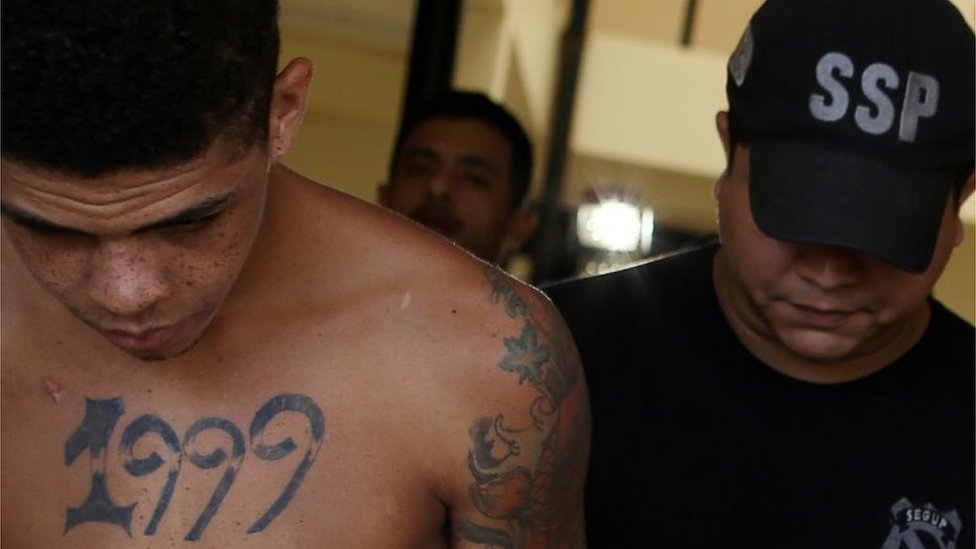 A prisoner is escorted during transfer to a federal jail, after a riot in a prison in the city of Altamira, Brazil, July 30, 2019.