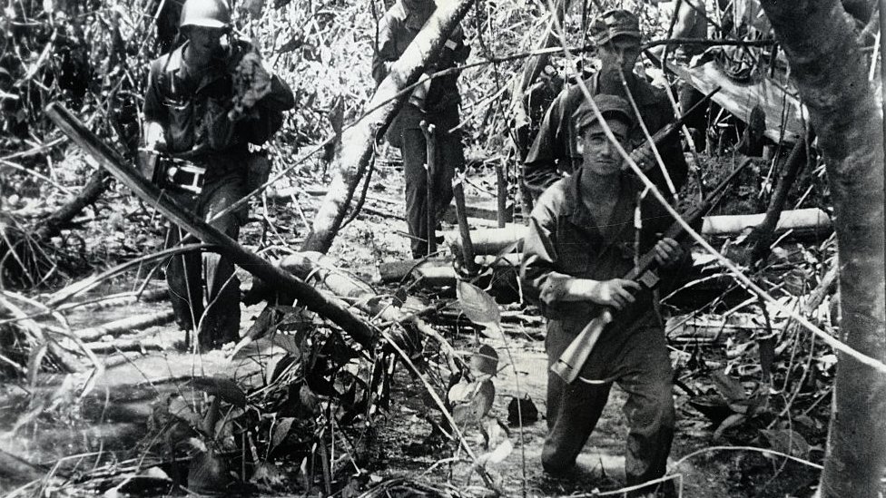 US troops advance against Japanese forces during World War Two