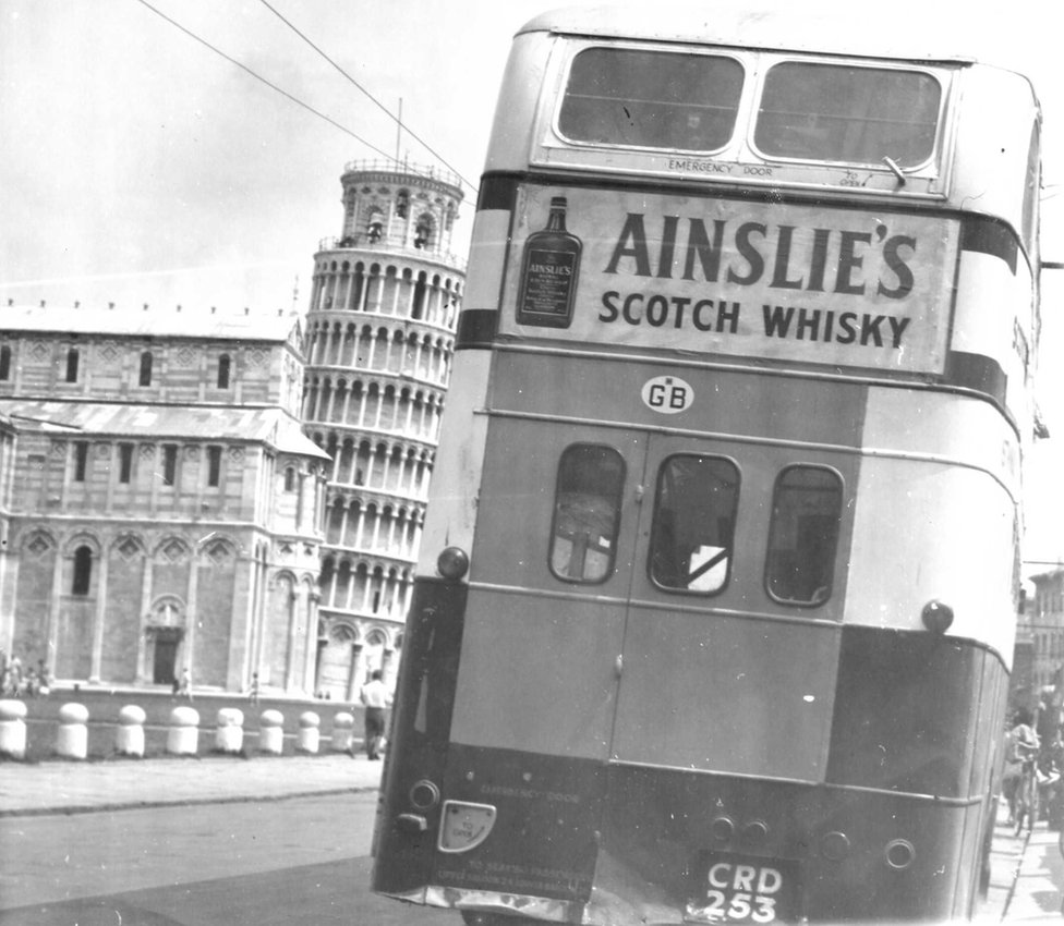 The bus parked up and leaning in Pisa, Italy