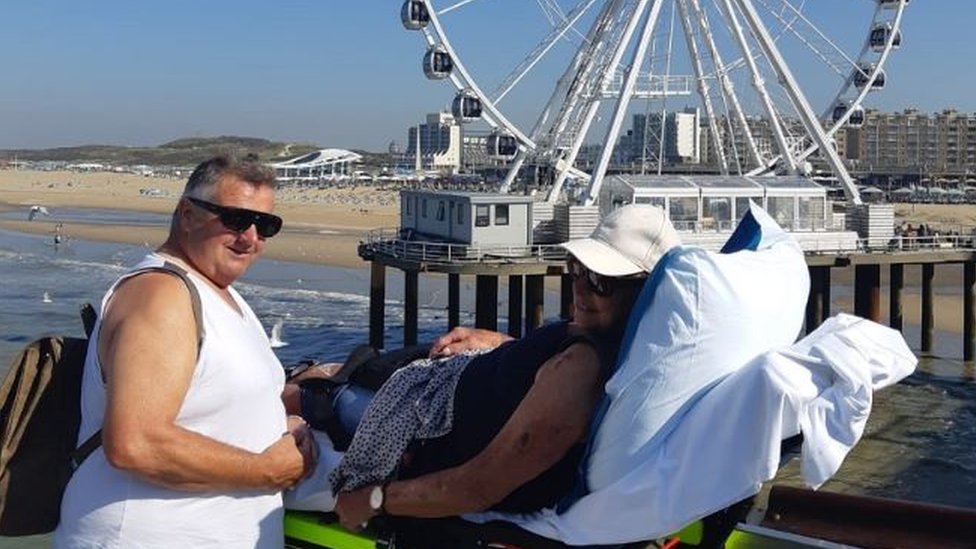 A woman in stretcher near the sea