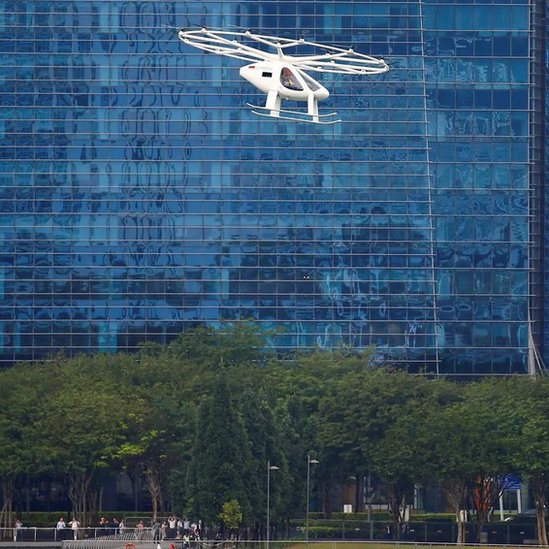 A Volocopter air taxi performs a demonstration in Singapore in October 2019 (Credit: Reuters)