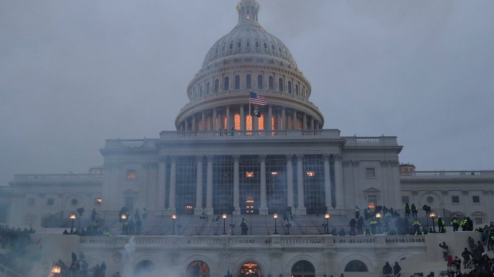 Supporters of Donald Trump clash with police officers in front of the US Capitol