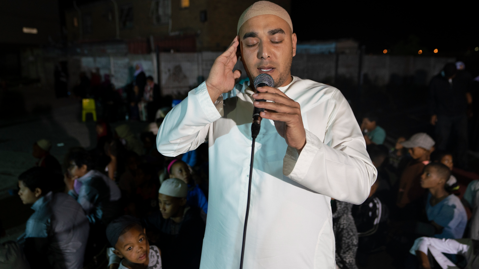 A man calling Muslims to prayer in Manenberg, Cape Town - South Africa