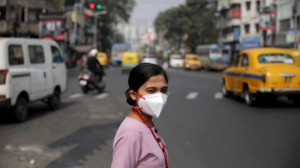 A beneficiary medical staff crosses the road after receiving a COVID-19 vaccine shot, manufactured by Serum Institute of India, at the vaccination centre at Amri Hospital in Kolkata, India, 03 February 2021.