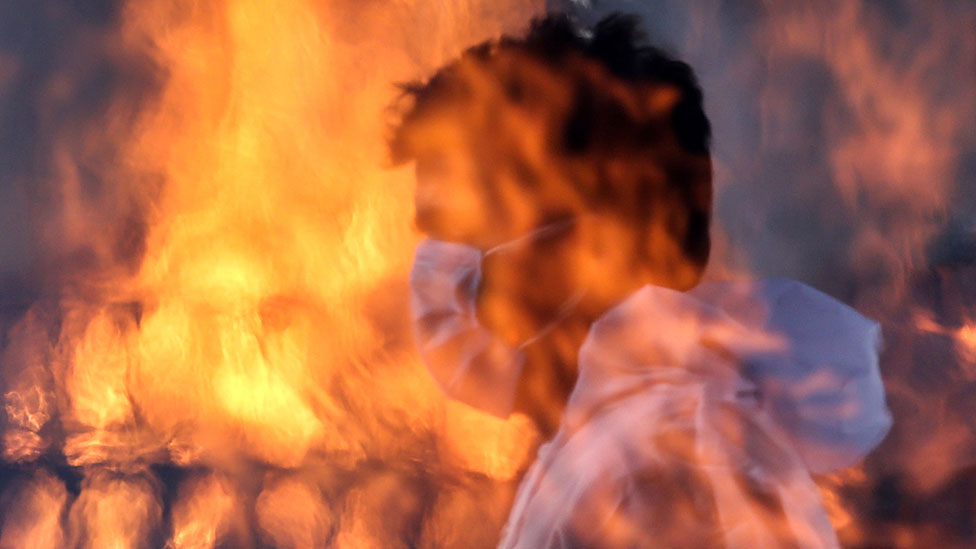 Worker at a crematorium in Delhi