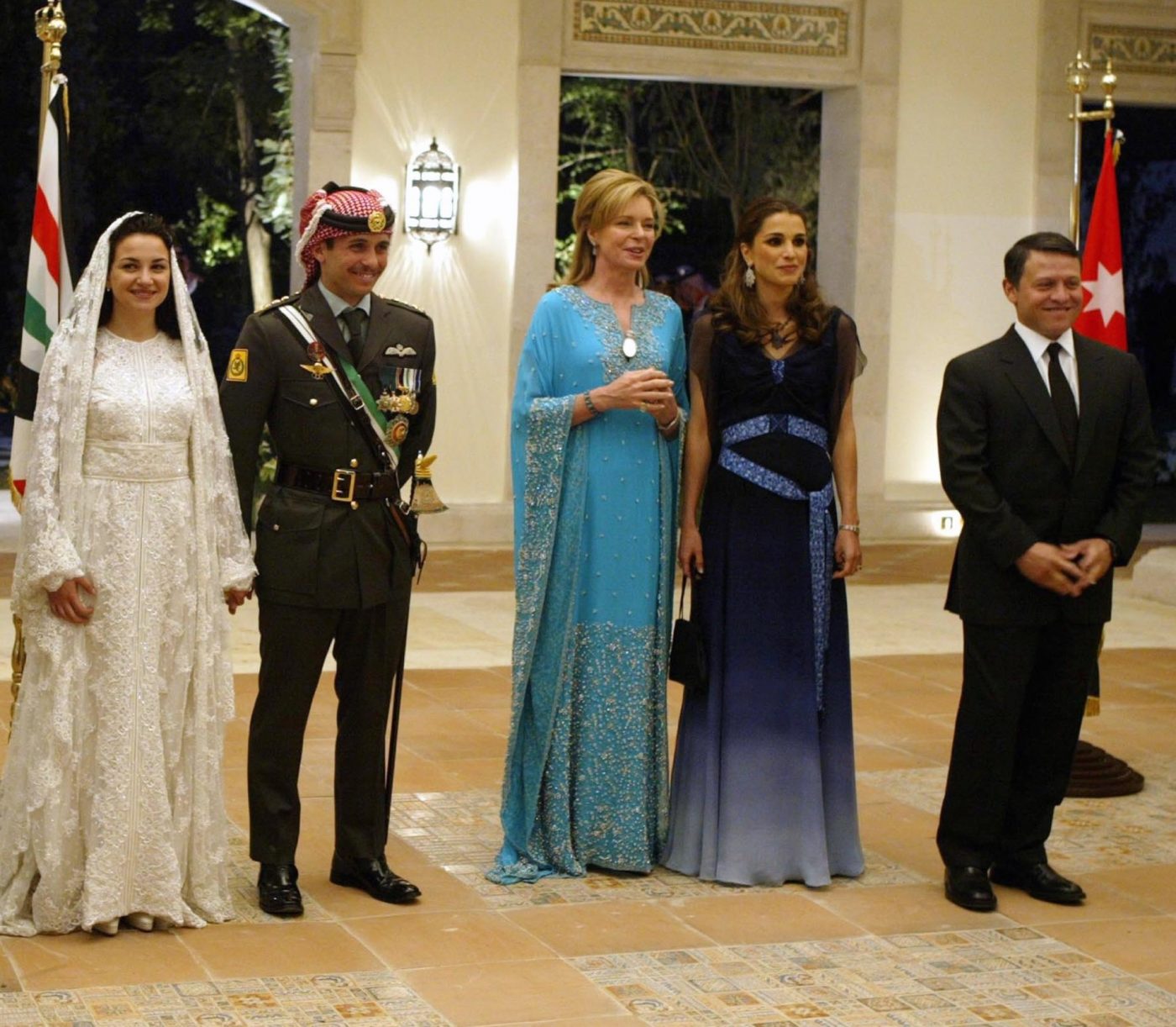 Jordan's King Abdullah II, his wife Queen Raniathe bride, attend the royal wedding on May 27, 2004 in Amman, Jordan