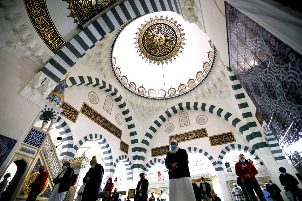 Muslim worshippers pray in a mosque