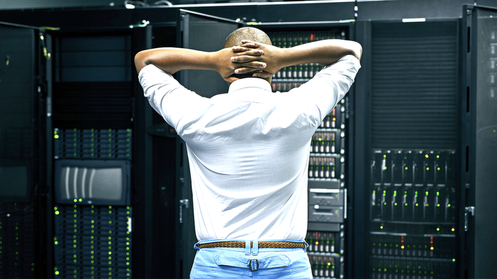 Man upset looking at servers
