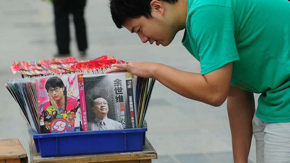 Pirate DVD and VCD are on sale at a street in Hefei, Anhui province September 23, 2009