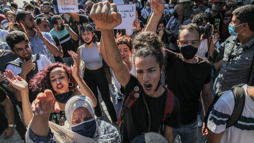 A man holds up a clenched fist during a demonstration in Tunisia