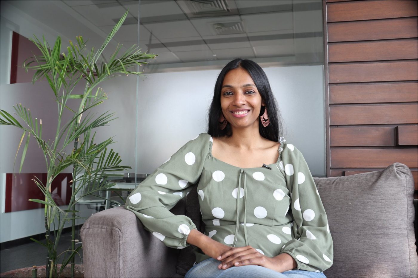 Pallavi sitting on a chair in her coaching room