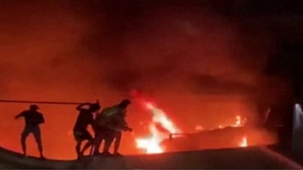 Civil defence forces tackle a fire at a hospital in the southern Iraqi city of Nasiriya