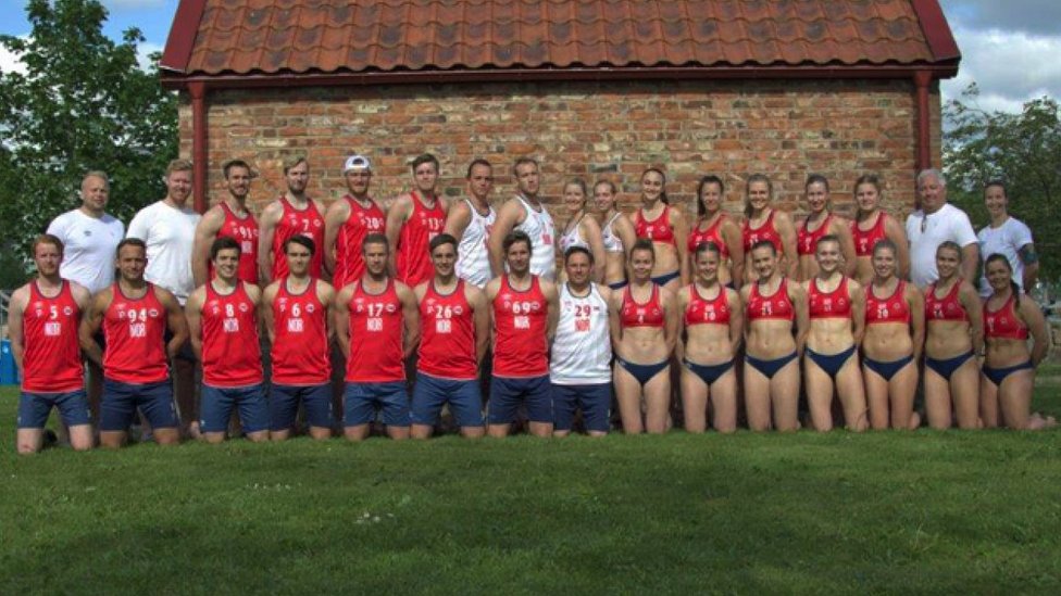 The male and female Norwegian teams pose side by side, the men wearing shorts and long tank tops, the women wearing small bikini tops and bottoms.