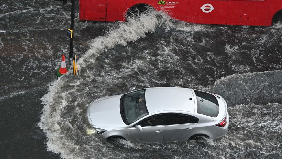 Car driving through flood water