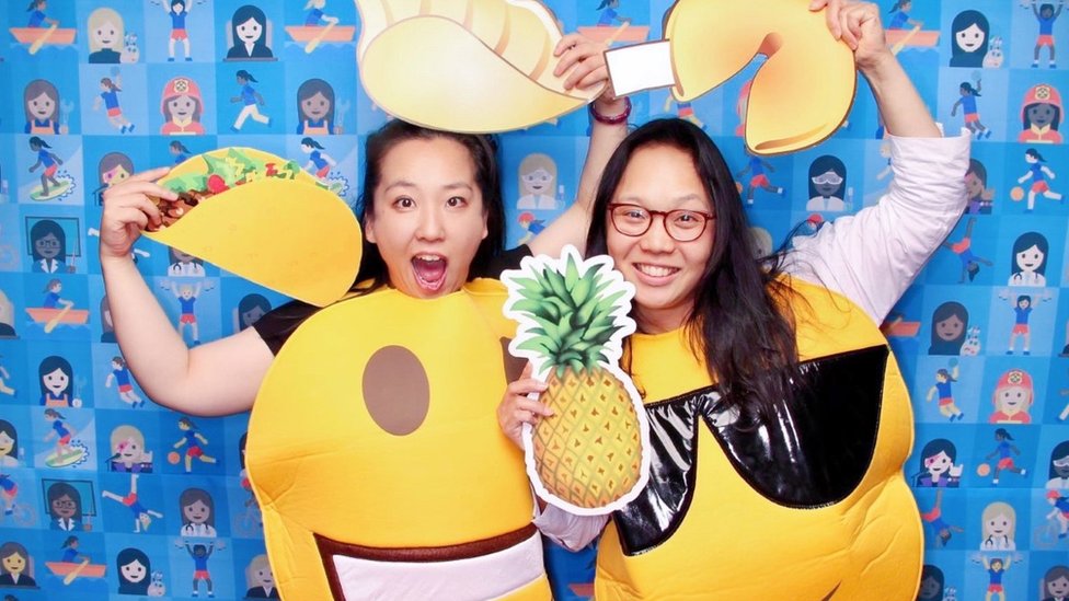 Yiying and Irene dressed as emoji