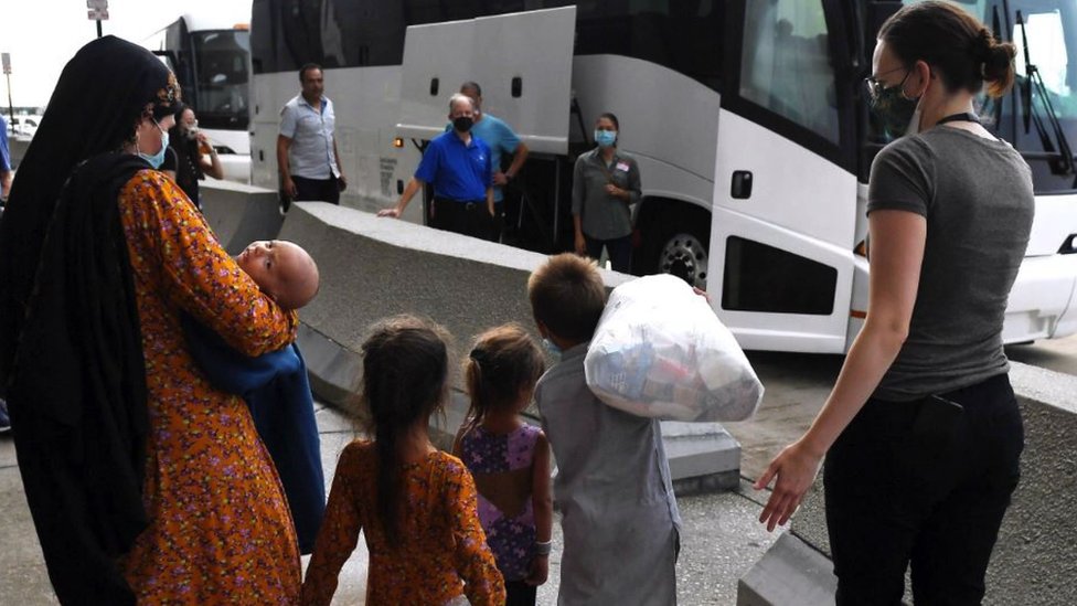 An Afghan family arriving at Dulles International Airport, Virginia, US