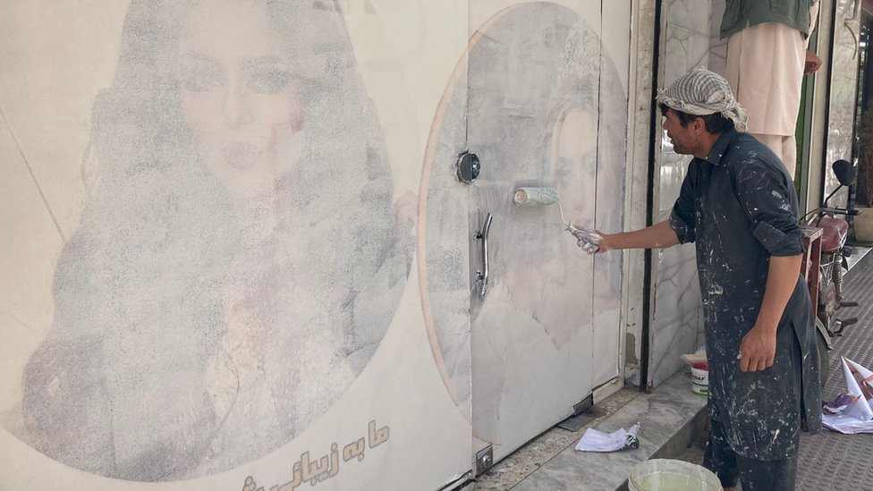 Paintings showing women being whitewashed in Kabul