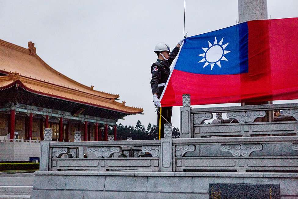 Honour guards prepare to raise the Taiwan flag in the Chiang Kai-shek Memorial Hall square ahead of the Taiwanese presidential election on 14 January 2016 in Taipei, Taiwan