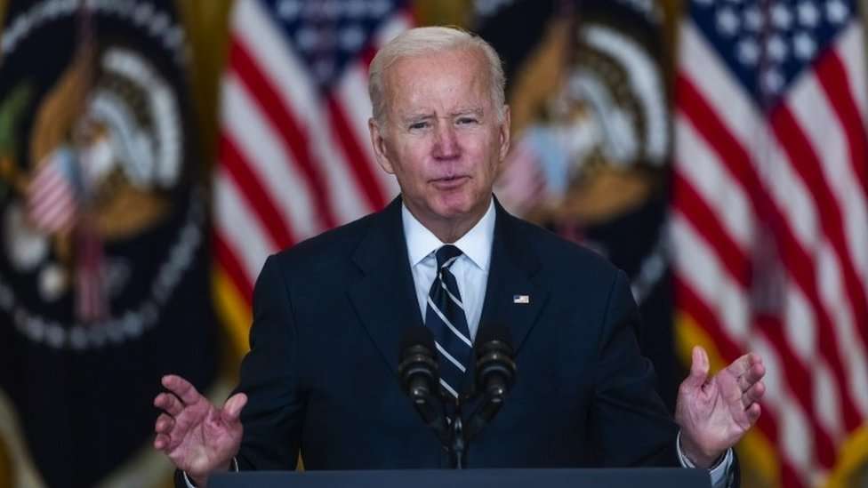 Joe Biden speaking from a podium