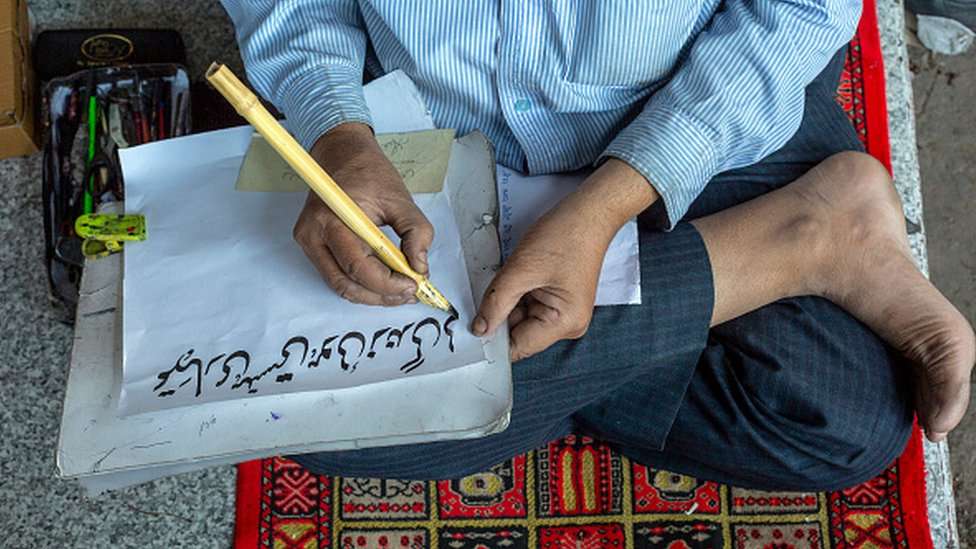 Mohammed Ghalib, a katib - traditional calligrapher - in Urdu Bazaar, Old Delhi, India.