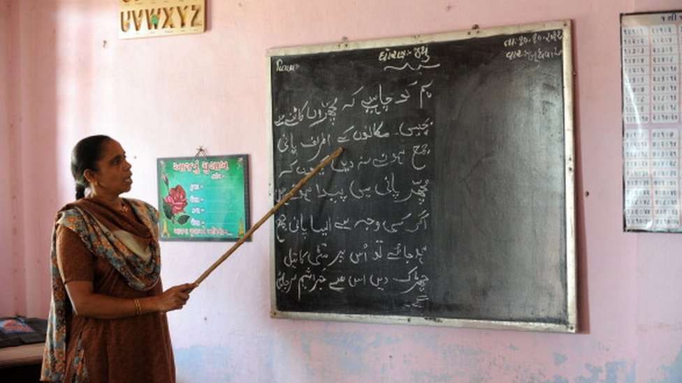 Urdu language teacher Afsana Khokhar teaches her students at Mahudha Urdu School at Mahudha some 65 kms. south east of Ahmedabad on October 11, 2012.