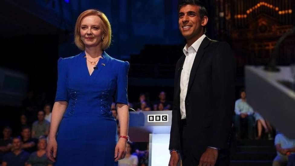 Britain's Foreign Secretary Liz Truss (L) and former chancellor to the exchequer Rishi Sunak, contenders to become the country's next prime minister, arrive to take part in the BBC's 'The UK's Next Prime Minister: The Debate' in Victoria Hall in Stoke-on-Trent, central England, on July 25, 2022