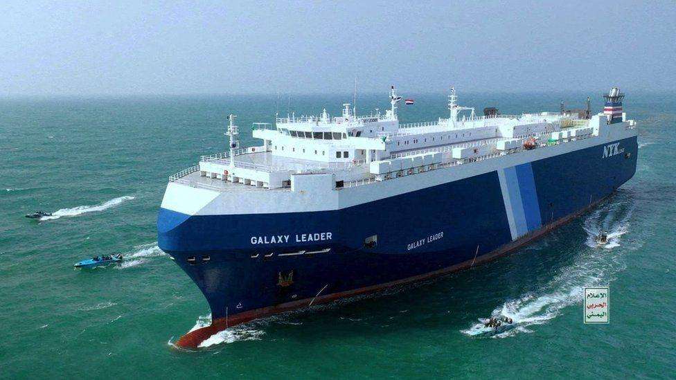 A massive vessel surrounded by smaller craft